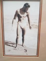 Framed Tom Blake in swimsuit photograph.