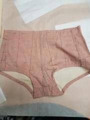 Catalina Mens 1920s/30s Cut (probably 30s or 40s manufacture) swim shorts. Cotton. Side-Zipper and button, grid pattern, peach/orange fabric (faded).